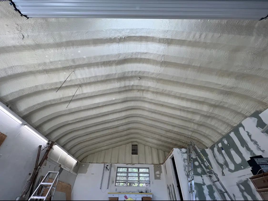 Spray polyurethane foam applied to the underside of a metal roof deck in Solebury